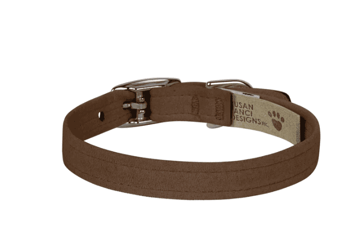 A dog collar made of brown fabric with metal buckle and D-ring for leash attachment, designed for pet comfort and style.